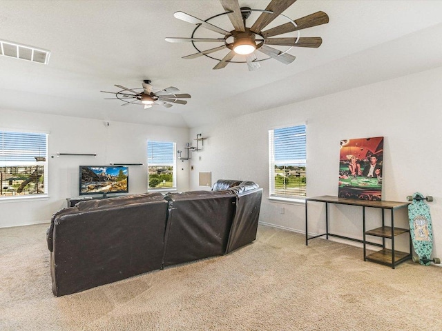 carpeted living room with baseboards, a ceiling fan, and visible vents