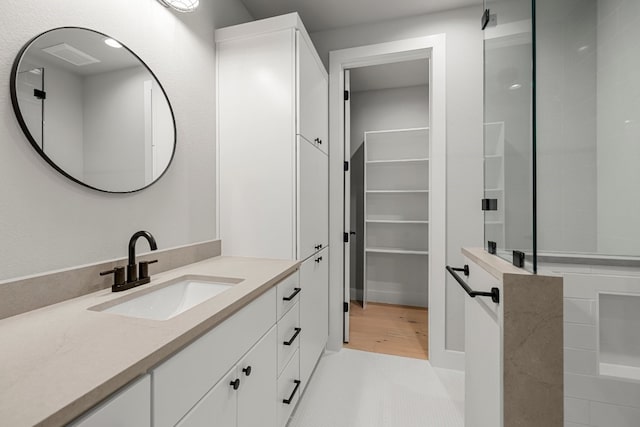 bathroom with vanity and hardwood / wood-style flooring