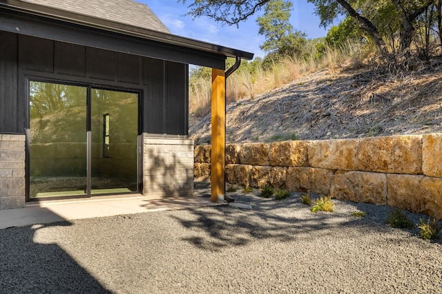 entrance to property featuring a patio area