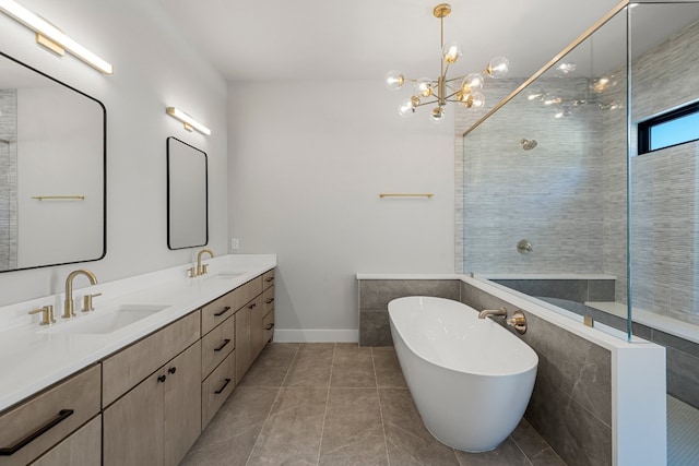 bathroom featuring independent shower and bath, vanity, a notable chandelier, and tile patterned floors