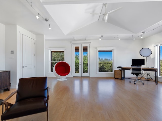 office featuring vaulted ceiling, ceiling fan, and light hardwood / wood-style flooring