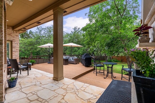 view of patio with area for grilling and an outdoor living space