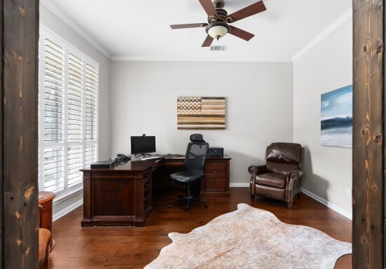 office with dark wood-type flooring, ceiling fan, and crown molding