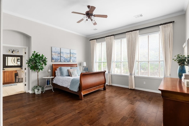 bedroom with crown molding, dark hardwood / wood-style floors, and ceiling fan