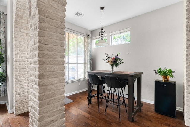 3109 Wild Rock Cv, Austin, TX 78732 - dining area featuring visible vents, baseboards, dark wood-style floors, and a wealth of natural light