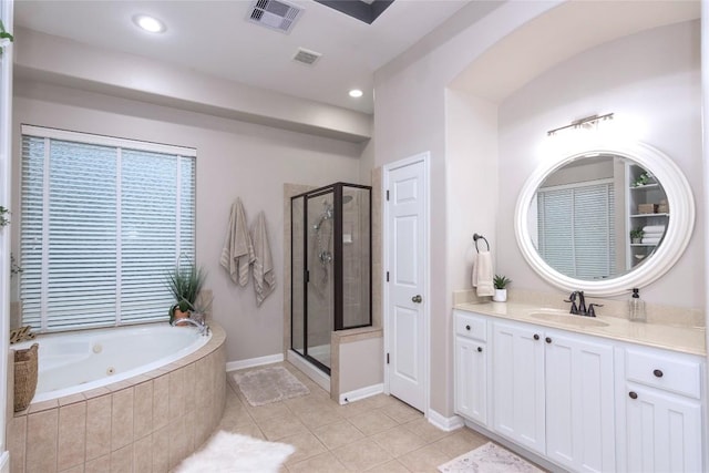 bathroom featuring tile patterned flooring, vanity, and independent shower and bath