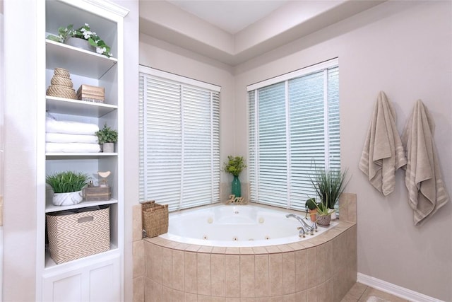 bathroom featuring tile patterned floors and tiled bath