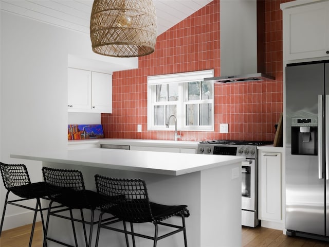 kitchen featuring stainless steel appliances, wall chimney exhaust hood, tile walls, and a breakfast bar