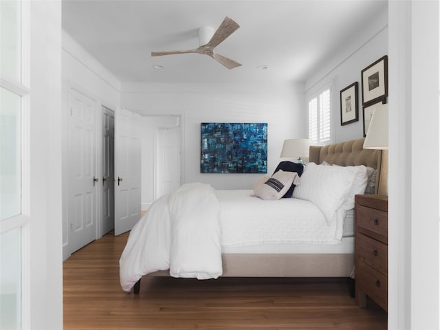 bedroom with wood-type flooring and ceiling fan