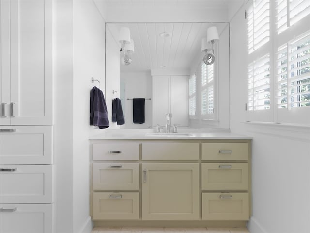 bathroom featuring vanity, tile patterned flooring, and a healthy amount of sunlight