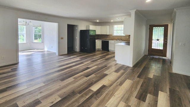 kitchen featuring black appliances, white cabinetry, dark wood-type flooring, and tasteful backsplash