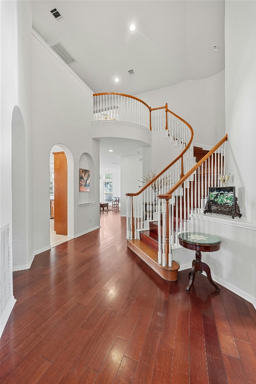 foyer featuring a high ceiling and hardwood / wood-style flooring