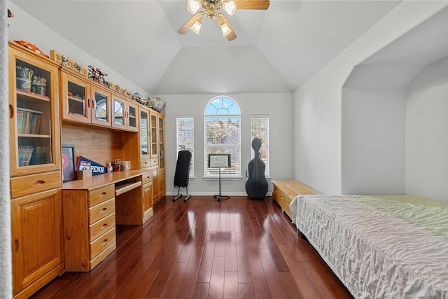 bedroom featuring ceiling fan, lofted ceiling, and dark hardwood / wood-style flooring