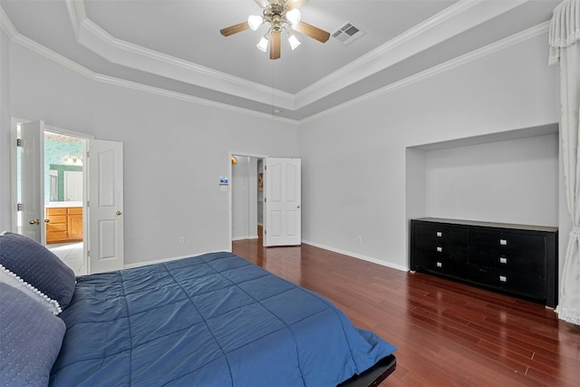 bedroom featuring crown molding, dark hardwood / wood-style flooring, ceiling fan, and a raised ceiling