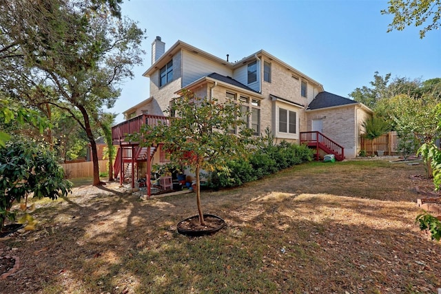 9228 Limoncillo Dr, Austin, TX 78750 - back of property with stairs, a chimney, a deck, and brick siding