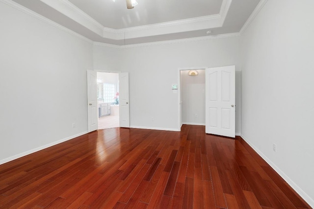9228 Limoncillo Dr, Austin, TX 78750 - unfurnished room with wood finished floors, a towering ceiling, a raised ceiling, and crown molding