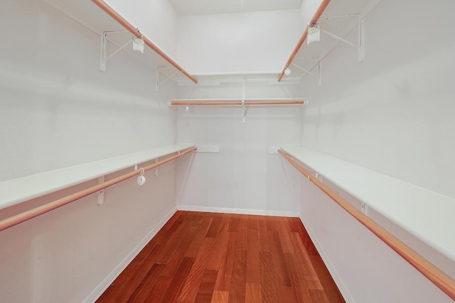 9228 Limoncillo Dr, Austin, TX 78750 - spacious closet featuring dark wood-style flooring