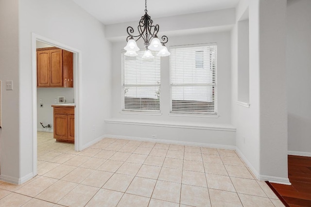 9228 Limoncillo Dr, Austin, TX 78750 - unfurnished dining area featuring a chandelier and light tile patterned floors