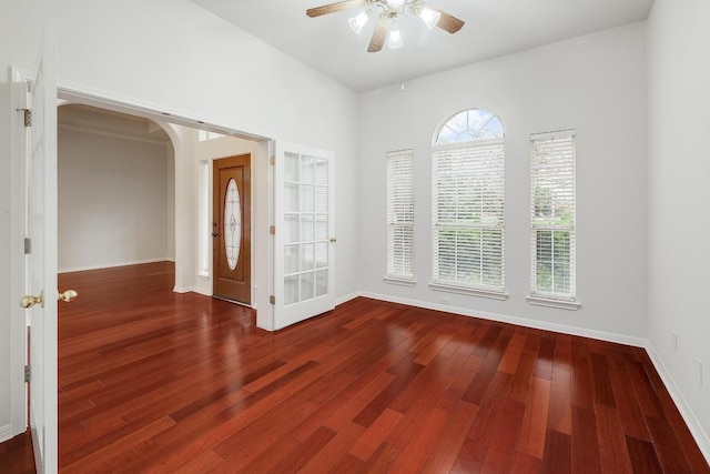 9228 Limoncillo Dr, Austin, TX 78750 - foyer with ceiling fan, wood finished floors, and arched walkways