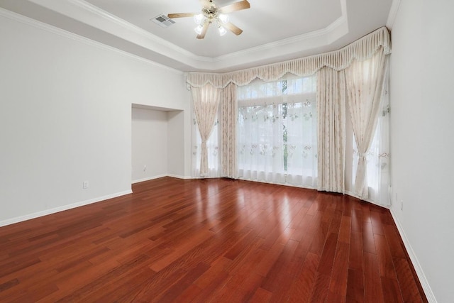 9228 Limoncillo Dr, Austin, TX 78750 - unfurnished room with ceiling fan, wood finished floors, crown molding, and a tray ceiling
