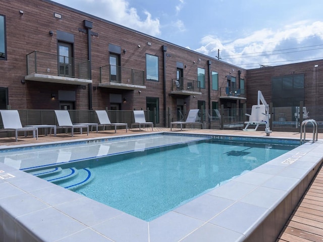 view of swimming pool with a patio