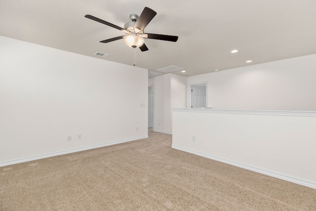 carpeted empty room featuring ceiling fan