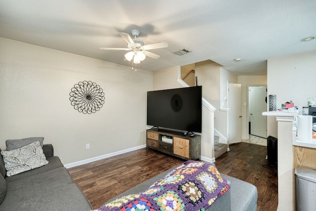 living room featuring dark hardwood / wood-style floors and ceiling fan