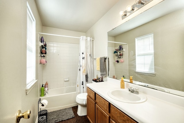 full bathroom with wood-type flooring, shower / bath combo, vanity, and toilet