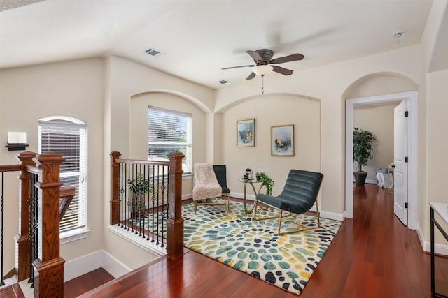 sitting room featuring dark hardwood / wood-style floors, vaulted ceiling, and ceiling fan