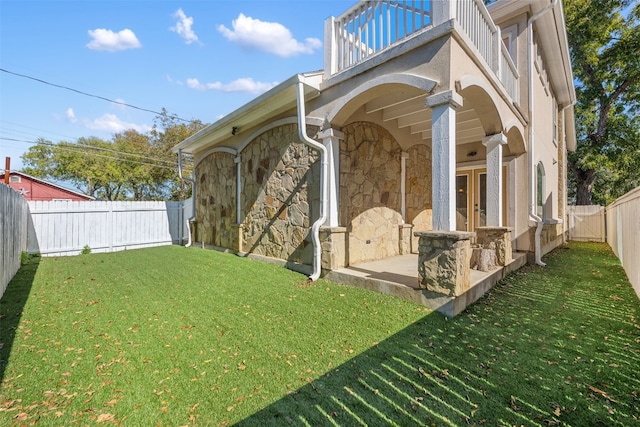 exterior space featuring french doors and a balcony