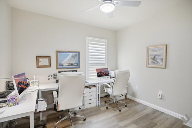 office area featuring ceiling fan, baseboards, and wood finished floors