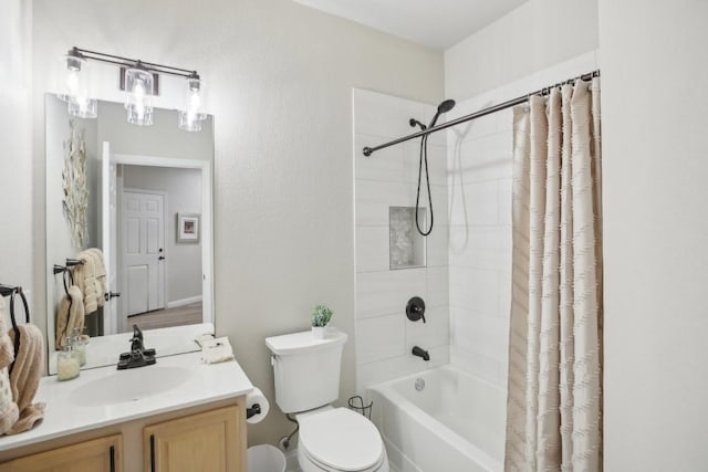 bathroom featuring shower / tub combo, vanity, and toilet