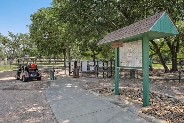 view of home's community featuring a gate and fence