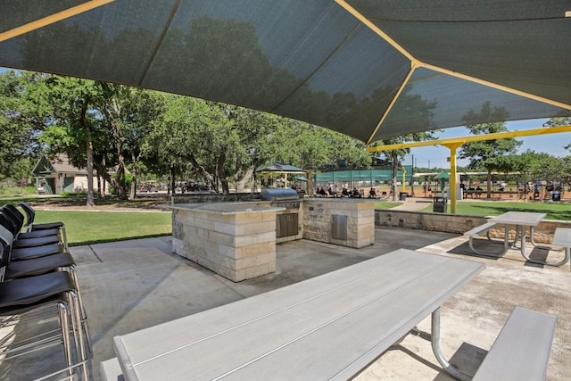 view of patio / terrace with area for grilling and an outdoor kitchen