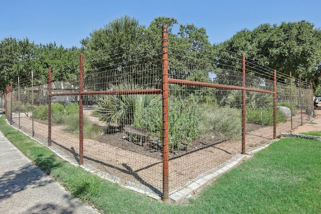 view of gate with fence