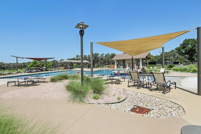 community pool featuring a patio area