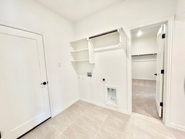 laundry area featuring gas dryer hookup, hookup for a washing machine, light carpet, and hookup for an electric dryer