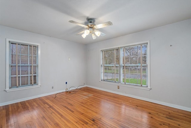 empty room featuring light hardwood / wood-style flooring and ceiling fan