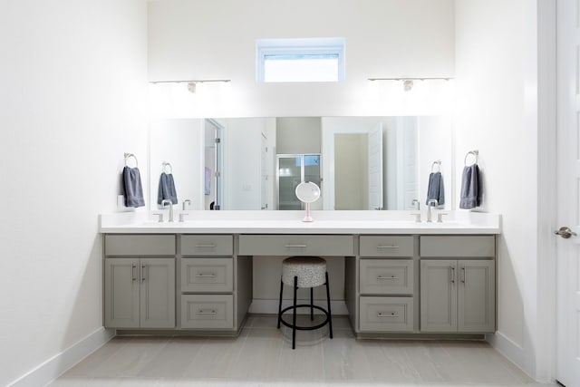 bathroom with walk in shower and vanity