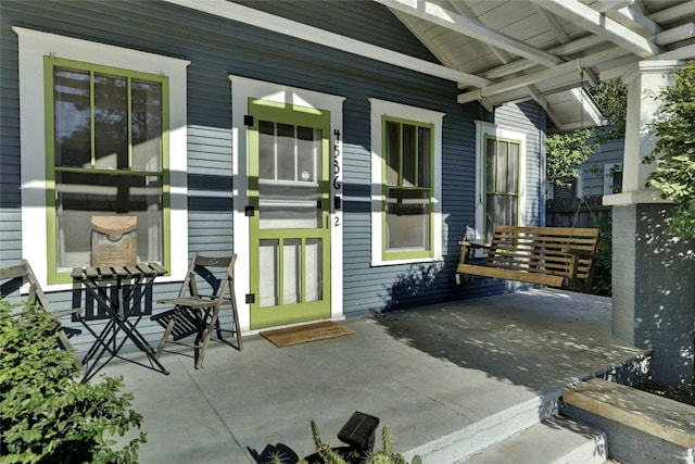 property entrance with covered porch