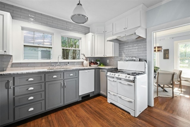 kitchen with dark hardwood / wood-style floors, white appliances, sink, and white cabinets