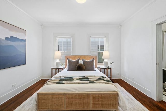 bedroom with ornamental molding and dark hardwood / wood-style flooring