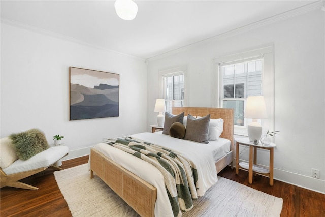 bedroom with ornamental molding and dark hardwood / wood-style flooring