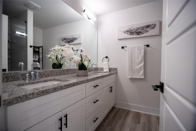 bathroom featuring hardwood / wood-style flooring and vanity