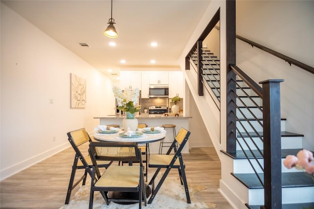 dining area featuring light hardwood / wood-style flooring