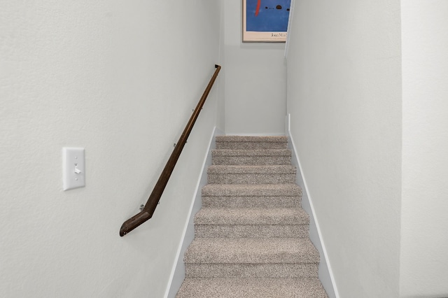 stairway with carpet floors