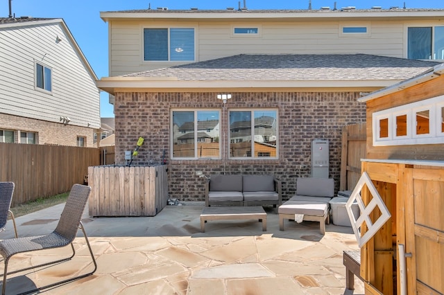 back of property with a patio and an outdoor hangout area