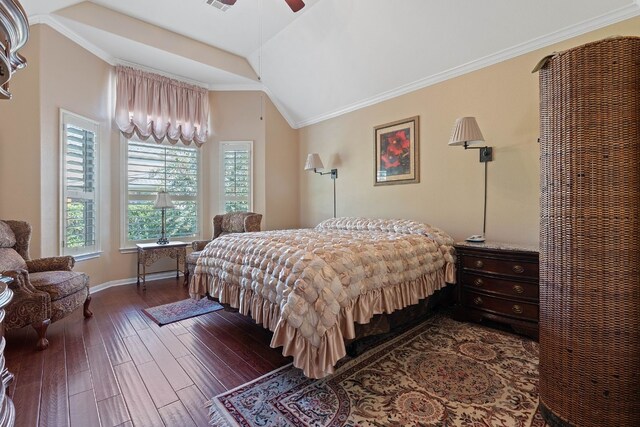 bedroom featuring ornamental molding, vaulted ceiling, ceiling fan, and dark wood-type flooring