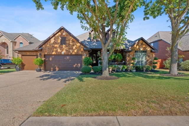 view of front of property featuring a front lawn and a garage