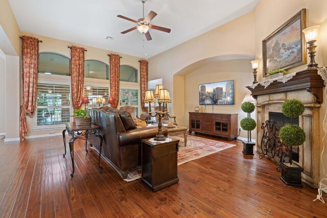 living room featuring ceiling fan and hardwood / wood-style floors